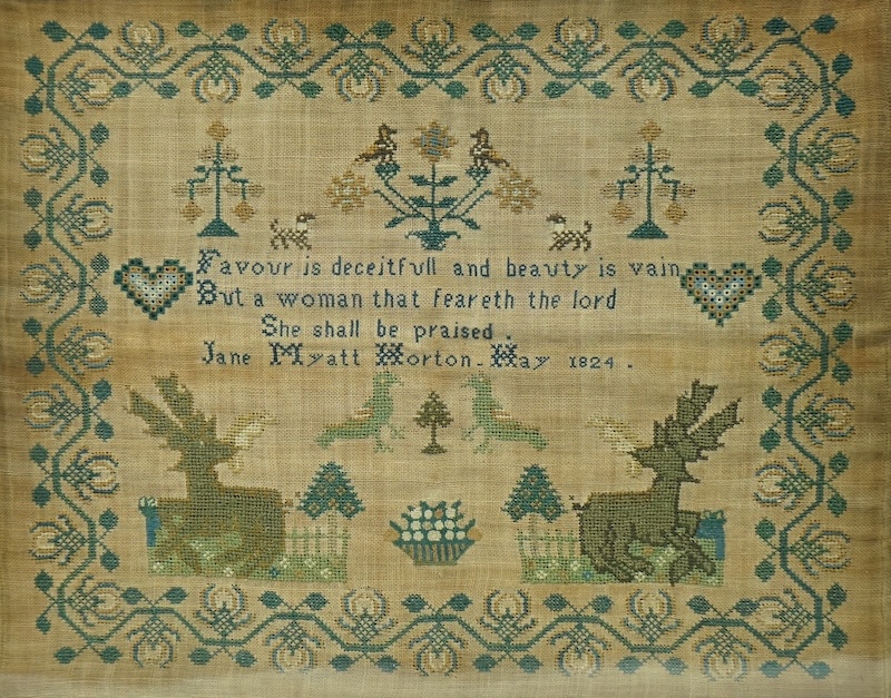 Two early 19th century framed samplers. One dated 1807 by M Buckland, worked with a church, blackbirds and trees and large verse, the other dated 1824 by Jane Myatt Horton worked with a wide border, with spot motifs of d